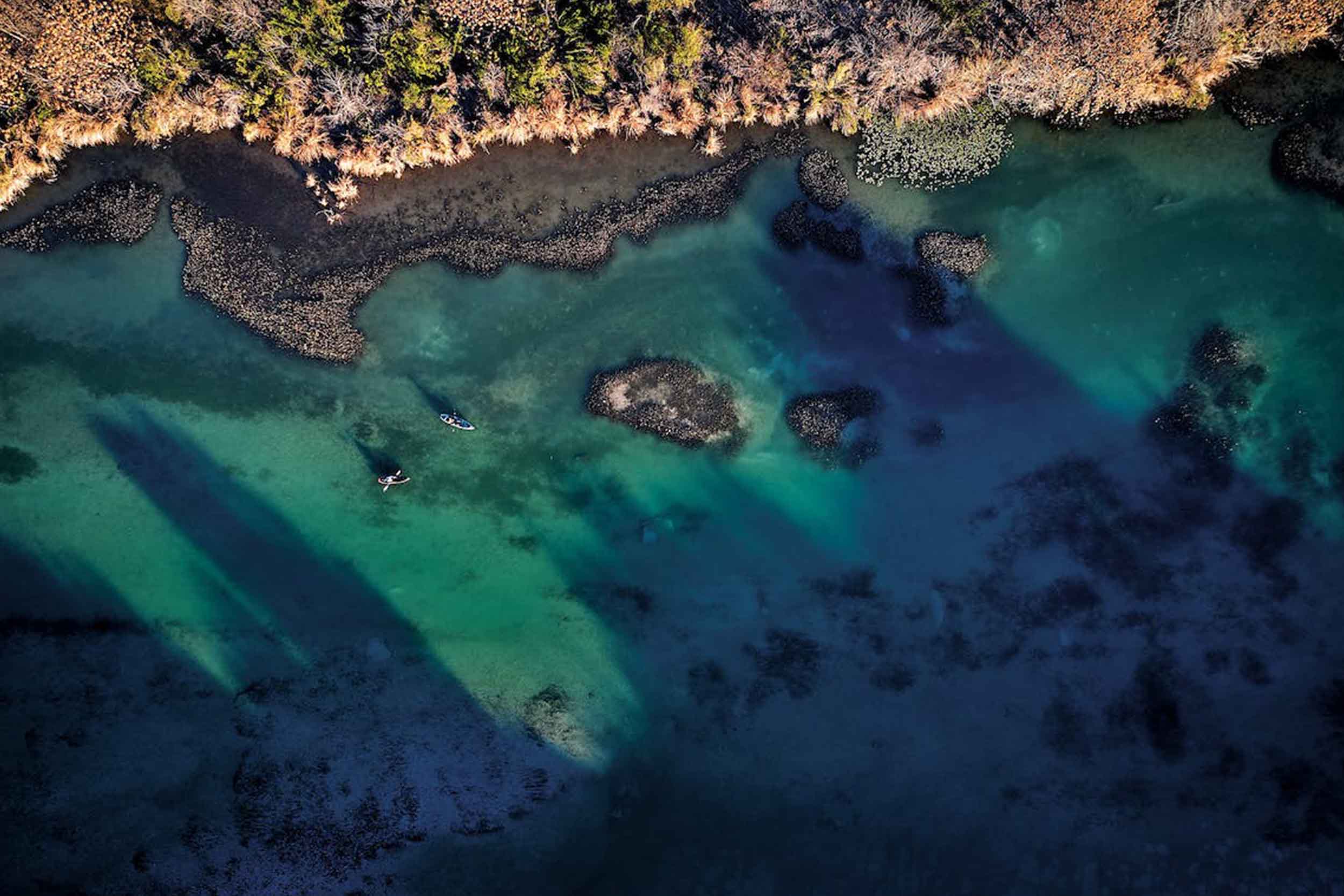 Drone view of turquoise water and gravel bars on the Devils River